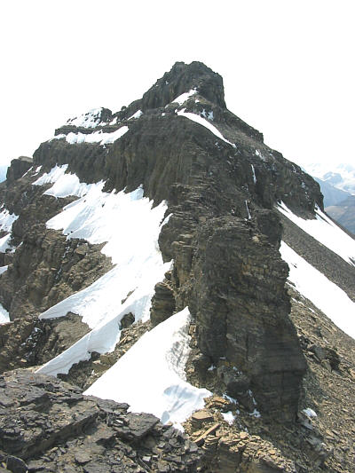 Bypass the knob in front on the right side before scrambling back onto the ridge.