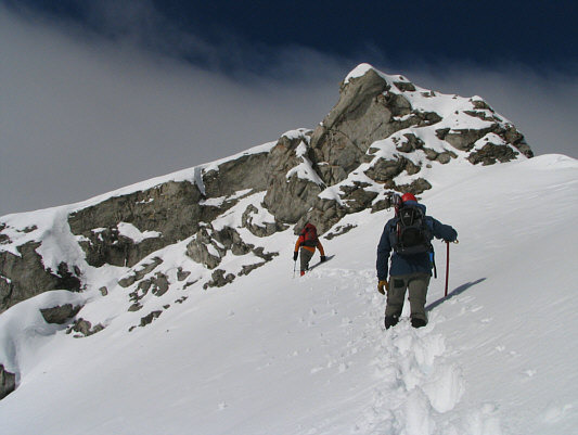 Raff would eventually lead us up a shallow chimney to the skyline ridge on the right.