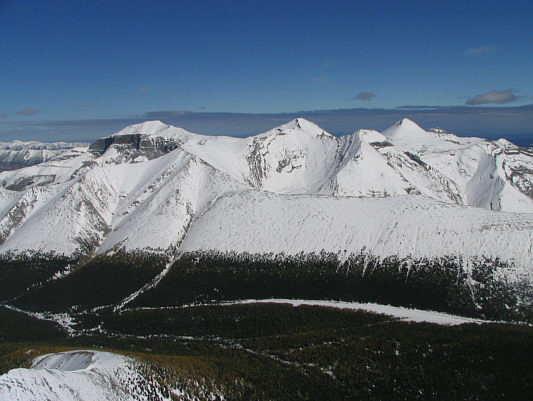 Those peaks might actually be easier to climb with snow on them!