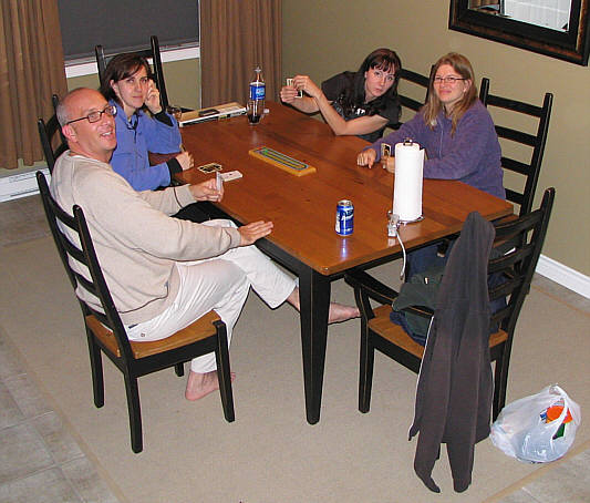 Is Dolly sneaking a peak at Kelly's cards??