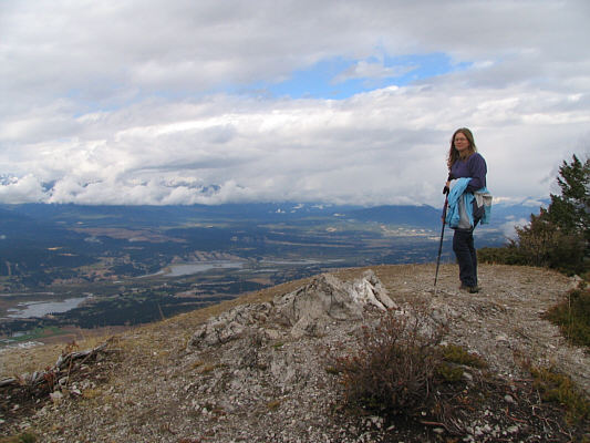 Nearby, there are some picnic tables and even a biffy with toilet paper!