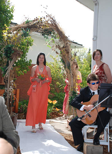 Aura is a navy lieutenant and also composed the recessional music for the ceremony.