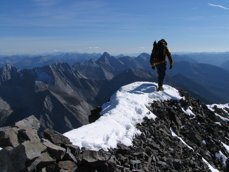 I tried to find a summit register, but the cairn was half buried by snow.