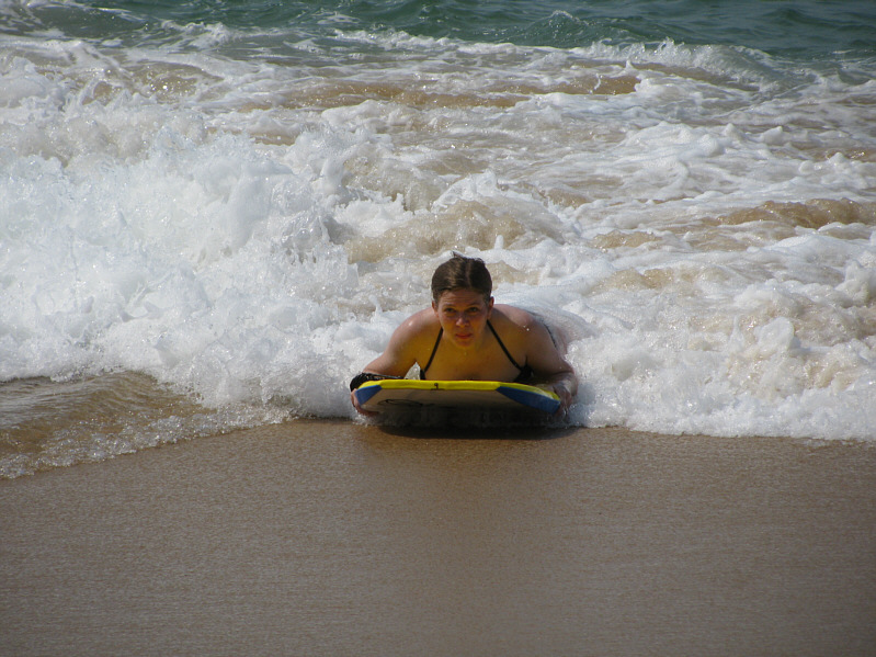 And gets a lot of sand in her bathing suit!
