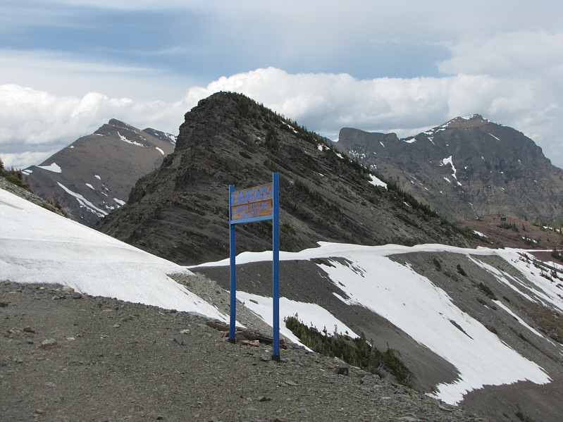 The woman probably turned around at the shack because of all the snow on the road traversing below North Peak.