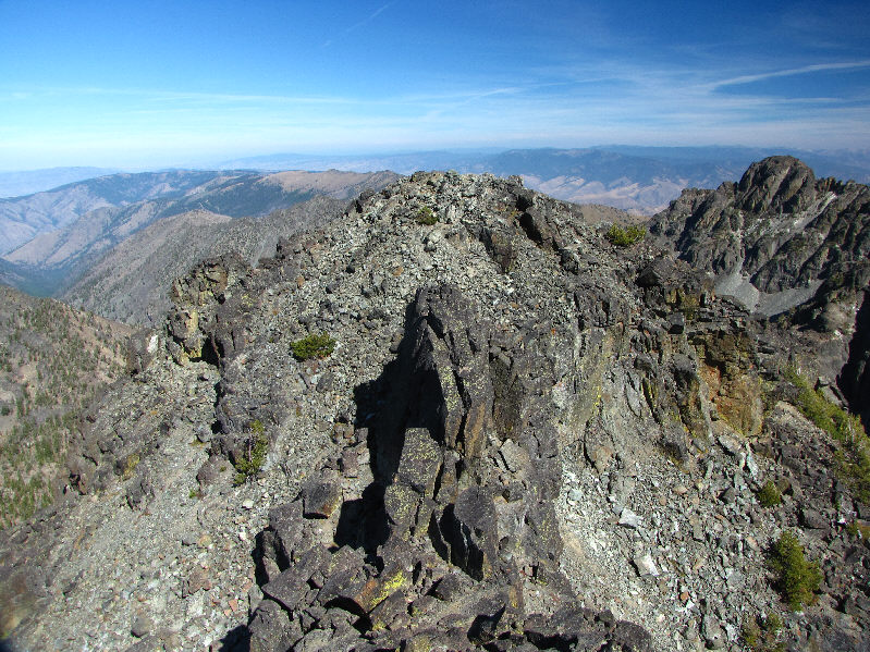 Tom Lopez says that the north summit is the highest one.