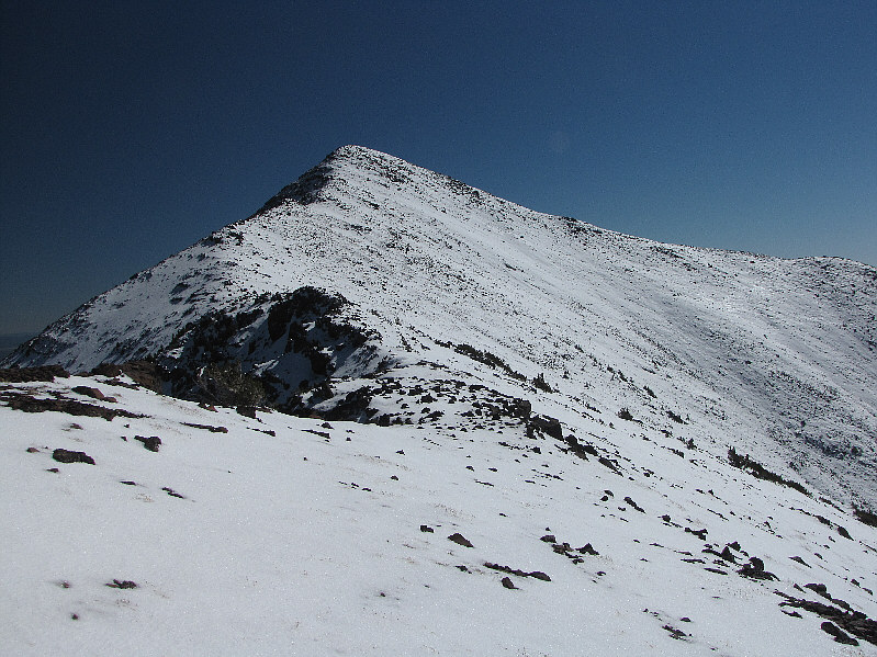 Looks to me like it's snow-covered enough to be hiked legally... 