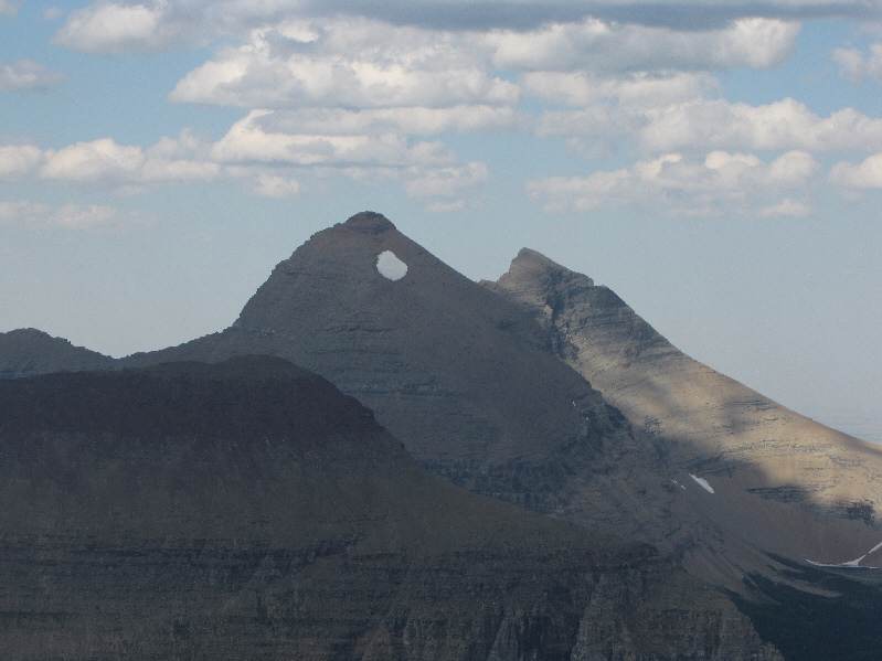 The pointy peak to the right of Mount Siyeh is simply called "Cracker".