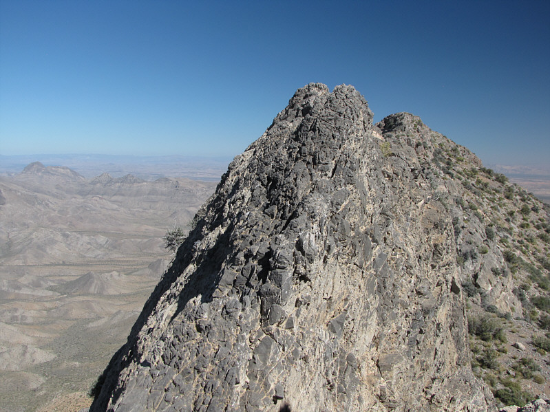 A lot of people probably traverse this part au cheval although it's probably easiest to grab the crest with your hands and step on the mini-footholds on the left.
