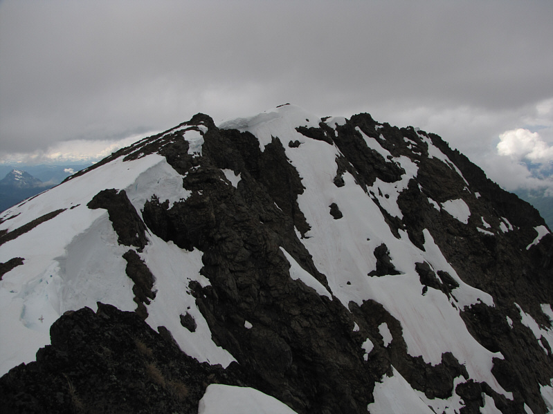 Careful that you don't stray onto the cornices as you traverse the summit ridge.