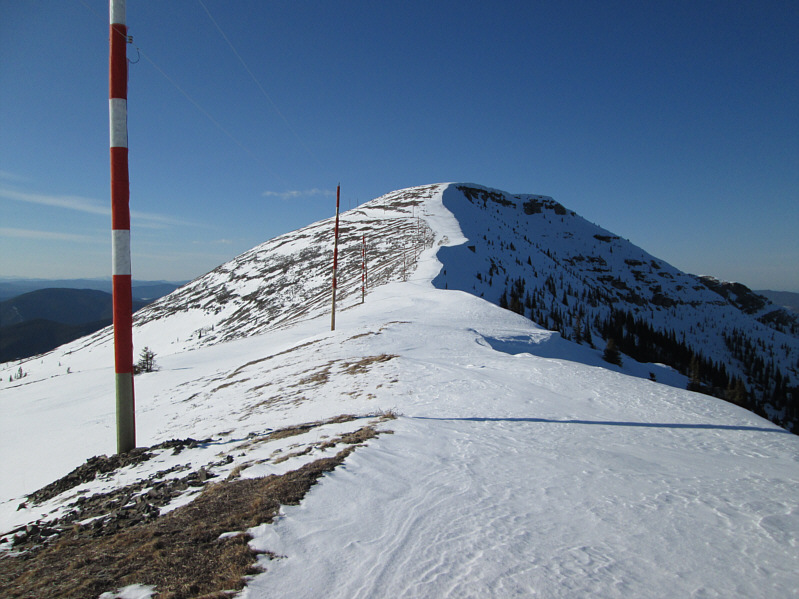 Hard-packed but skiable--just steer clear of the cornices!