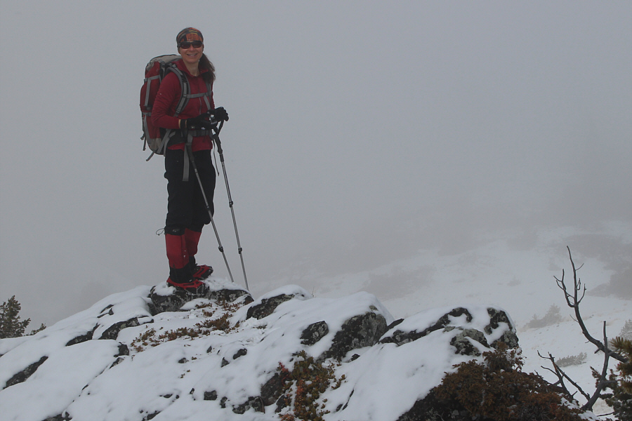 She sure is colour-coordinated--matching pack, shirt, gaiters, and ice cleats!