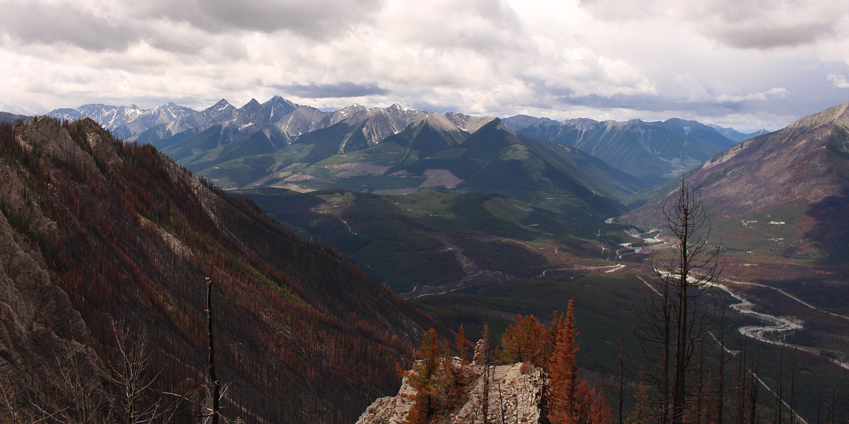 At the left edge of the photo, Mount Mike is partly obscured by clouds.