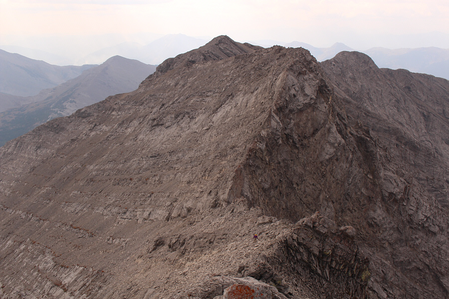 If not heading back to the main summit, it might be possible to drop down the basin at lower left to return to the road.