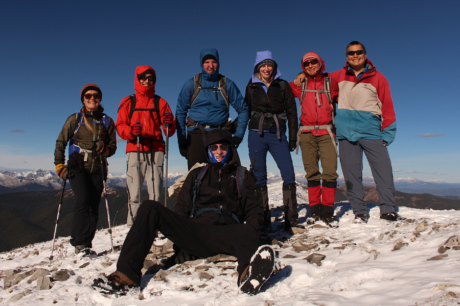 Being the senior person in the group, Bob is allowed to sit for the group photo!