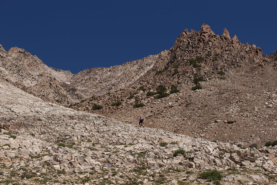 Some people scramble up another gully out of view to the right.