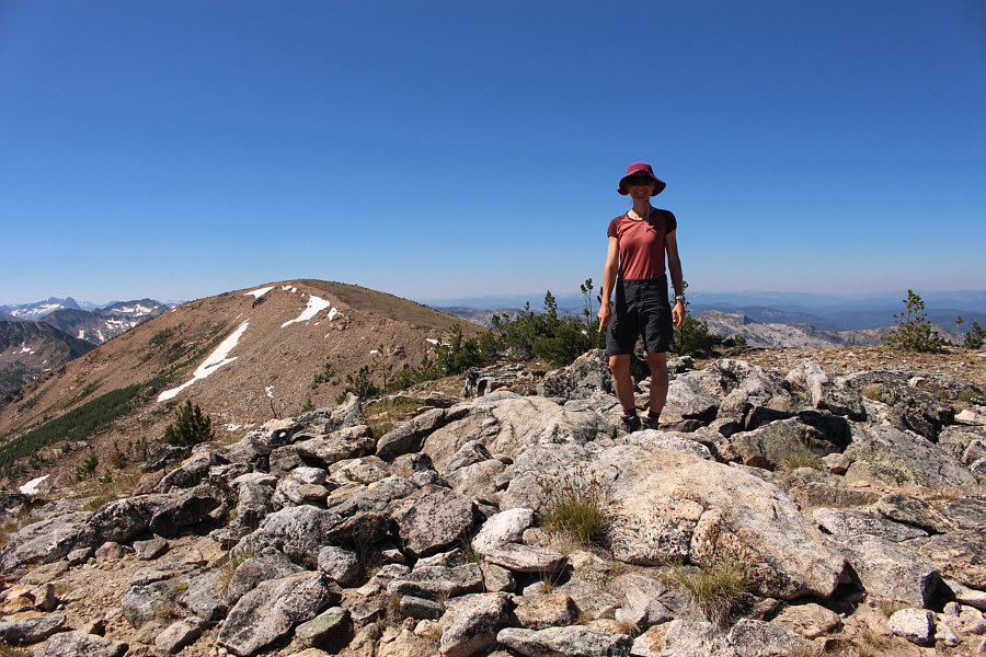 Zosia is pointing at a survey marker.