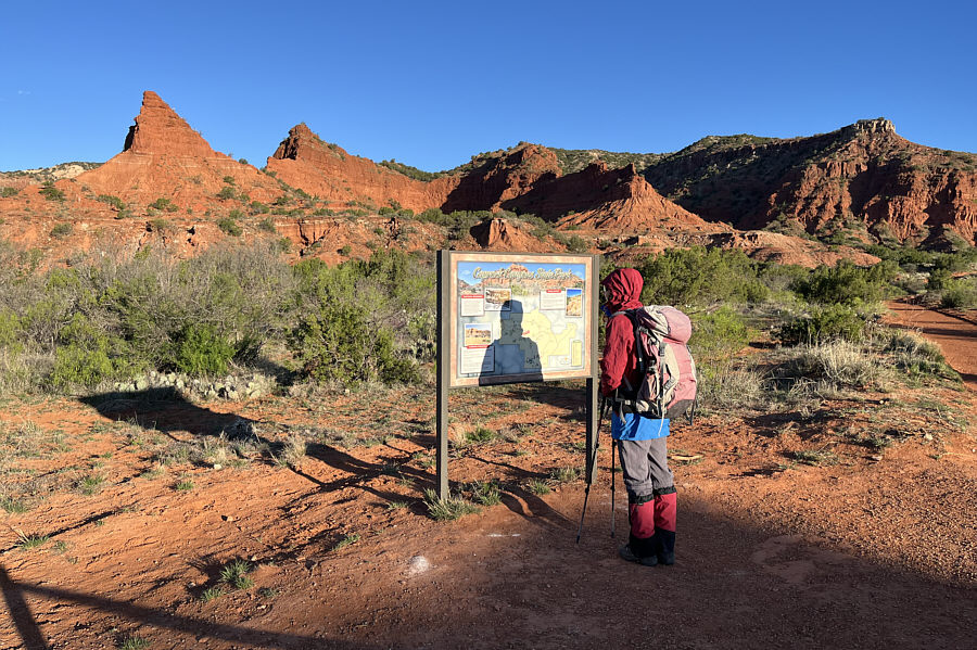 Zosia loves trailhead reading material!