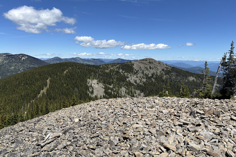 There are some other hikers near the summit.