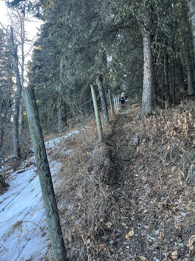 Be careful not to snag your down jacket on the barbed wire!