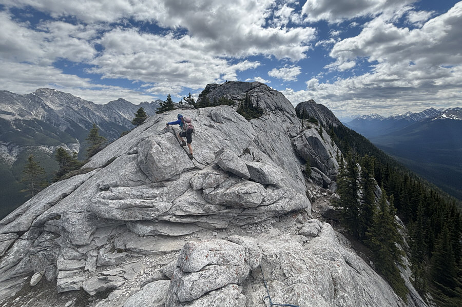 There's a girl from New Zealand sitting on top of this peak.