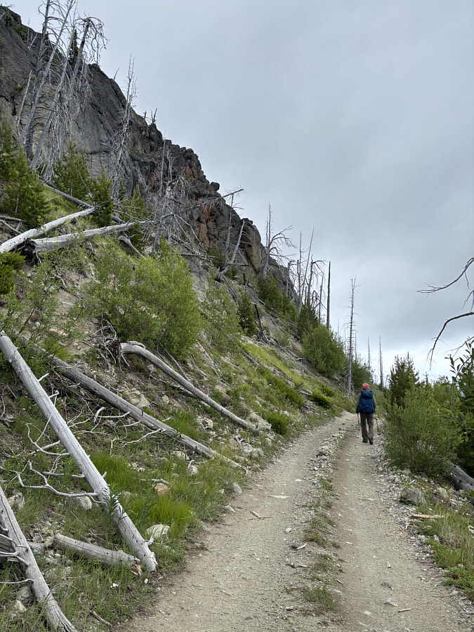 The road passes under some impressive cliffs here.
